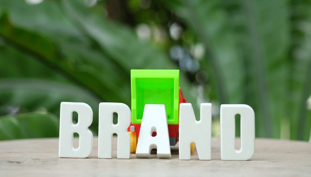 Hand arrange white letters BRAND Hand arrange white letters BRAND